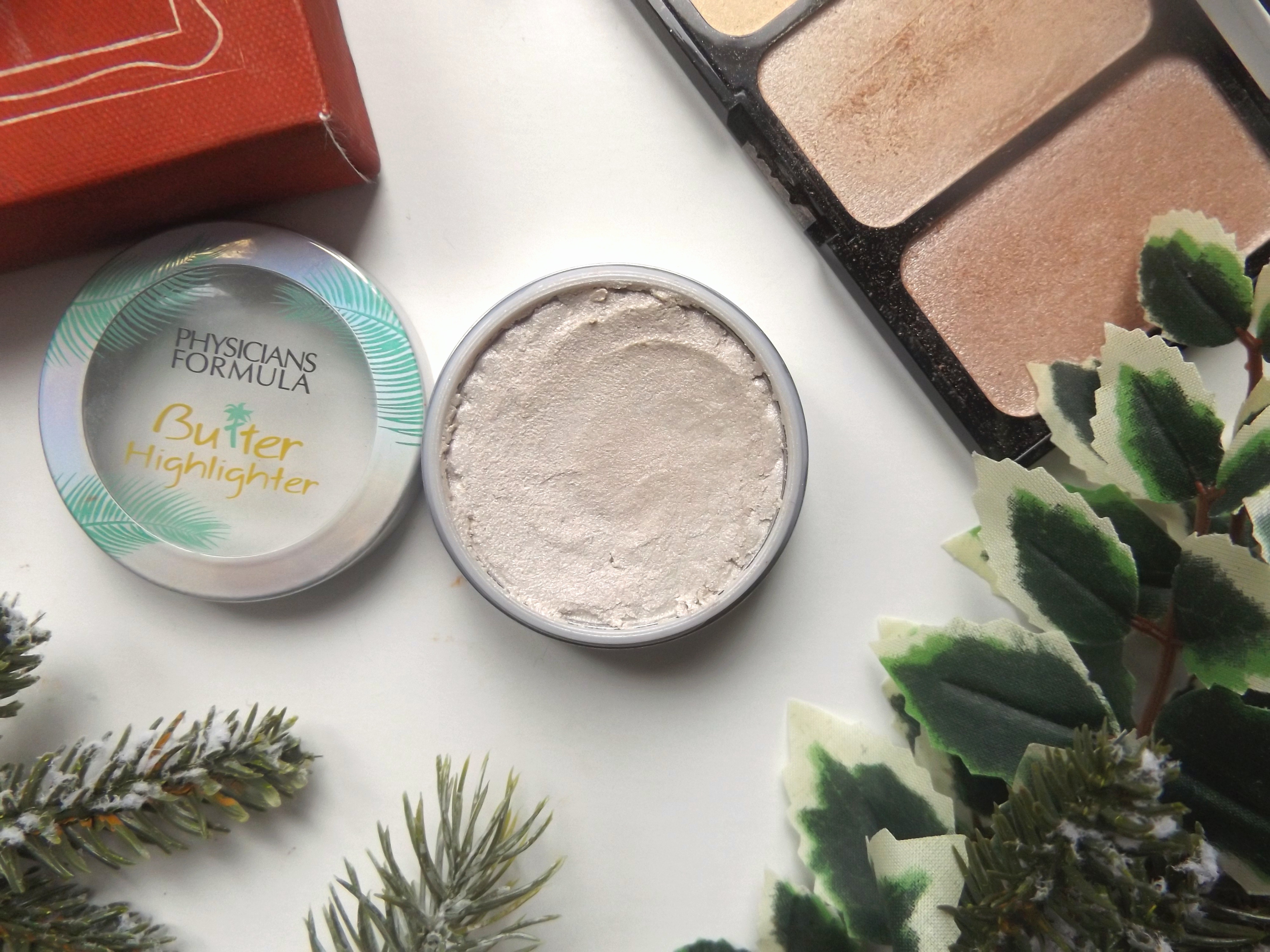 Physicians Formula highlighter - open, pearly white shade with a creamy texture