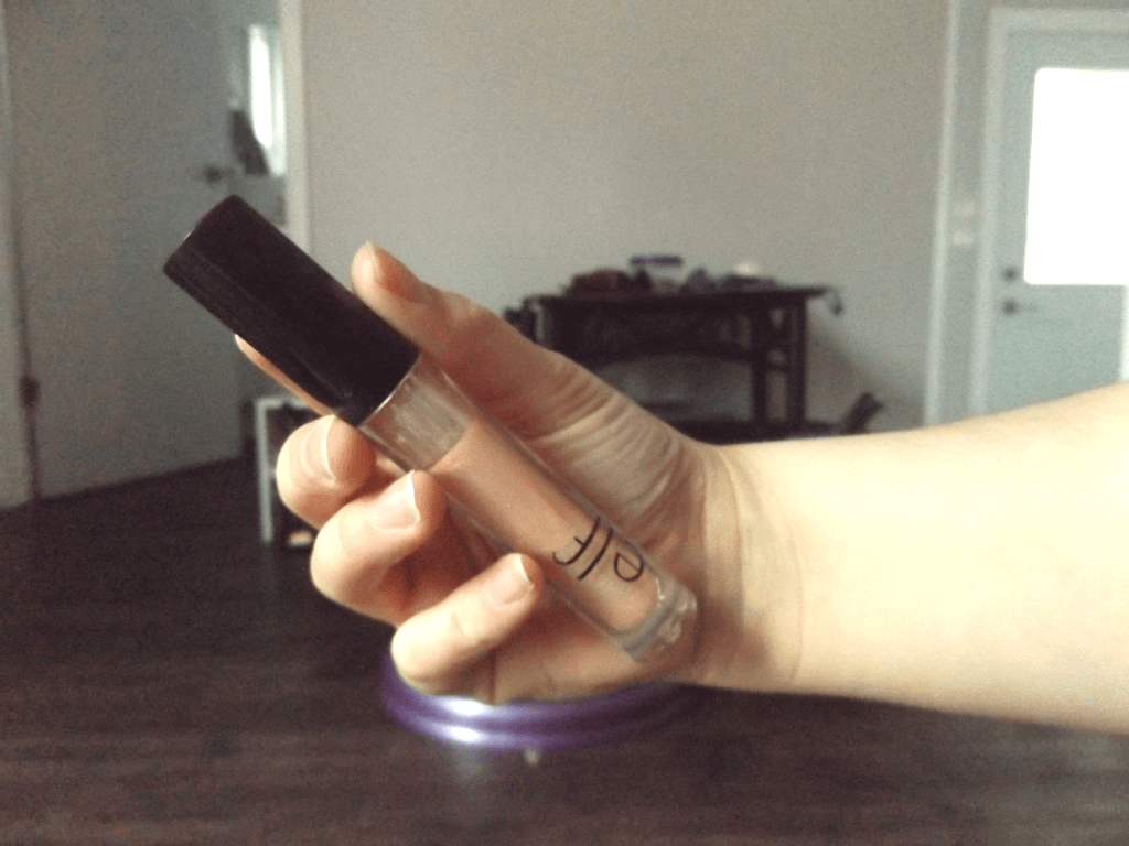 Me holding the ELF plumping gloss