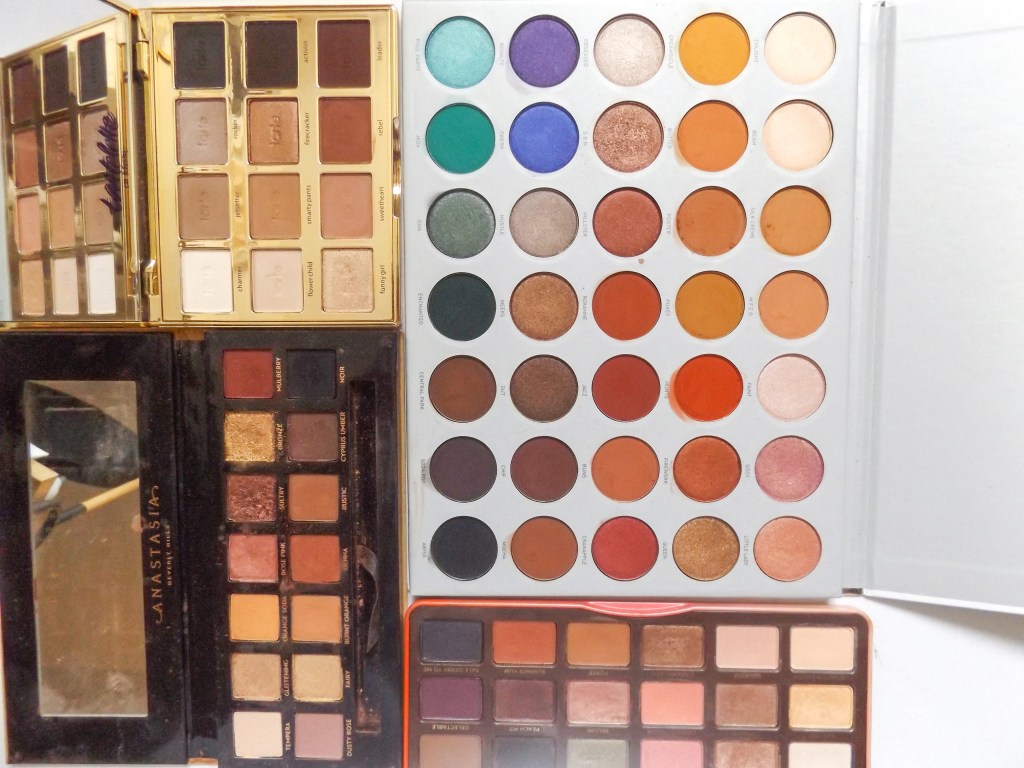 Clockwise: Jaclyn Hill Palette, Too Faced Sweet Peach, ABH Soft Glam, Tarte Tartlette in bloom